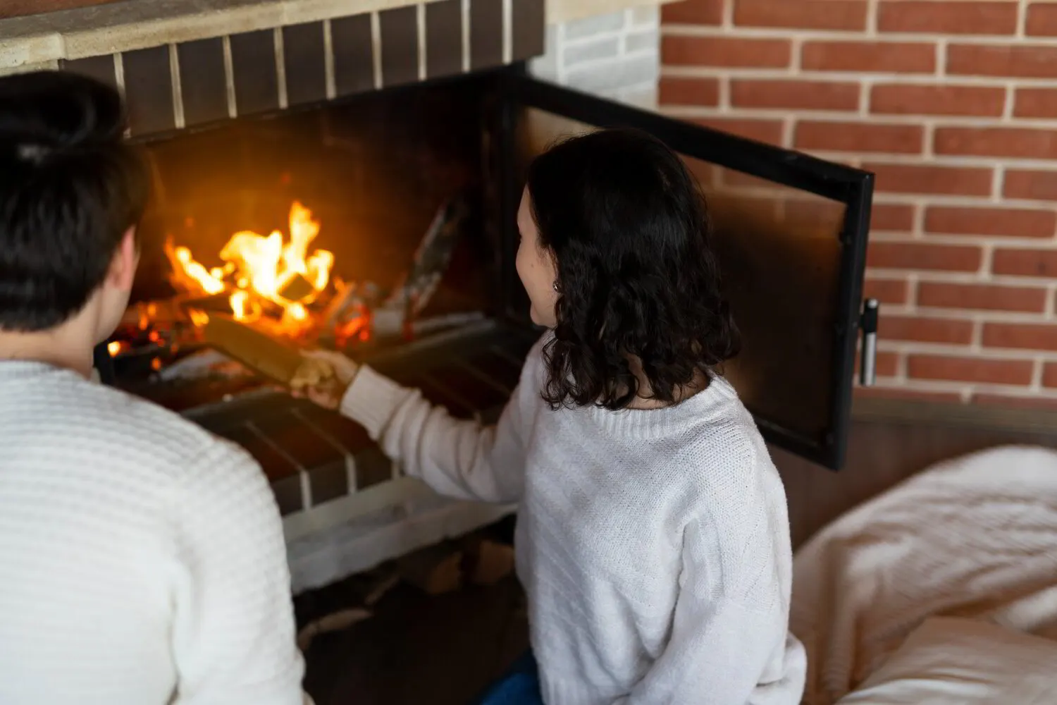 Old crumbling gas logs being removed from an Akron, Ohio fireplace