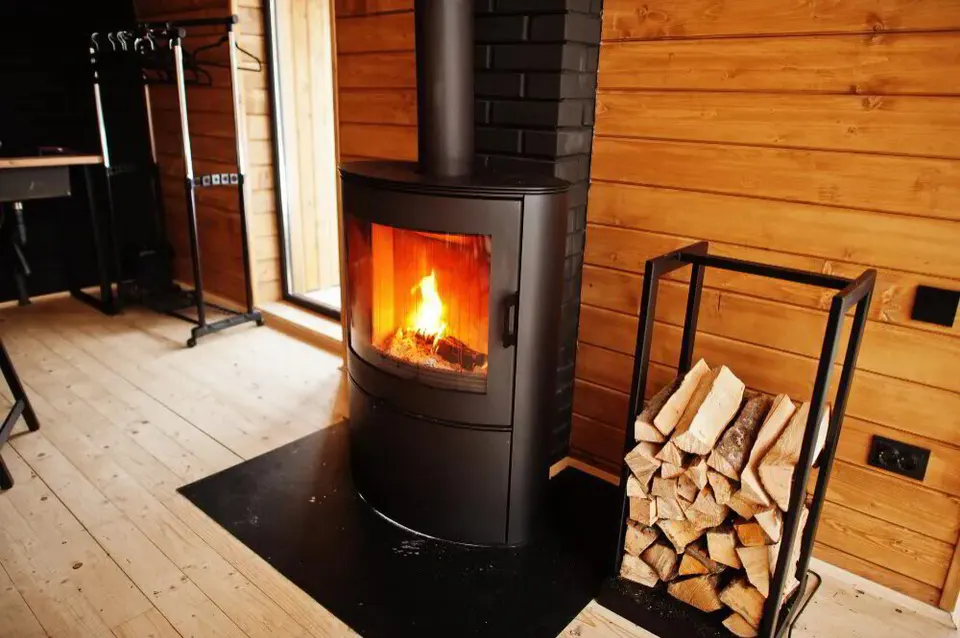 New gas log set with safety pilot burner installed in a brick firebox
