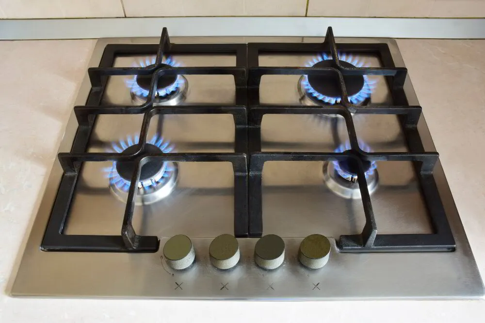 Commercial gas stove connection with restraining cable in a Canton, Ohio kitchen