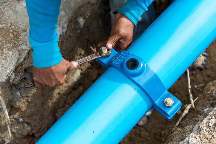 New polyethylene water line connected to a main shutoff valve in a basement